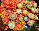 A picture of step 6 of Garlic Peas Mushrooms.
