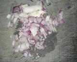 A picture of step 2 of Boiled Nduma (arrowroot) with Cardamon and Onion.