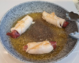 Foto del paso 7 de la receta: Rollitos de pollo y jamón en salsa de pimientos del piquillo