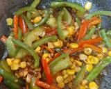 A picture of step 5 of Orange Chicken with fried rice.