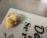 Une image de l'étape 1 de Diots à la tomate, ail et persil.