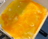 A picture of step 3 of Japanese white and yellow Egg Roll.