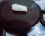 A picture of step 4 of Delicious tasty banana nutella bread roll.