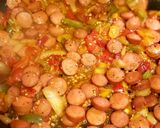 A picture of step 5 of Shakshuka with hot dogs.