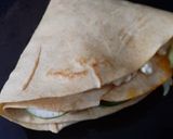 A picture of step 7 of Tortilla Wrap with egg and veggies.