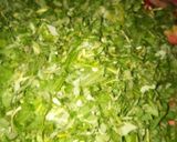 A picture of step 1 of Green (Efo) and rice.
