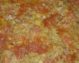 A picture of step 5 of Dam allu with colourful zeera rice.