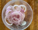 A picture of step 11 of Dal Bati Churma with pickled onions.