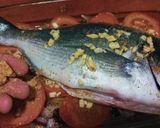 Foto del paso 4 de la receta Dorada al horno sobre cama de tomate y al limón