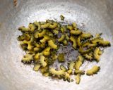 A picture of step 7 of Pavakkai /bitter gourd pitlai.