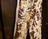A picture of step 2 of Sloppy joes stuffed french bread.