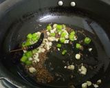 A picture of step 5 of Brinjal Kadhi with bajra roti.