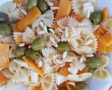 Foto del passaggio 8 della ricetta Farfalle rigate alla zucca con olive e pinoli