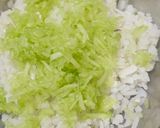 A picture of step 2 of Atukulu with coconut and cucumber in south style.