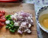 A picture of step 1 of Egg tomato onion omlette.