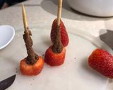 A picture of step 2 of Strawberry Santas 🎅 🌲.