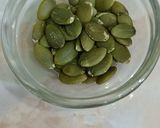 A picture of step 6 of Broken Wheat Kheer with pumpkin seeds.