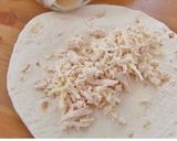 A picture of step 4 of Creamy White Chicken Enchiladas.