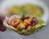 A picture of step 5 of Honey, soy and lemon grass Pork with Mango in Lettuce cup.