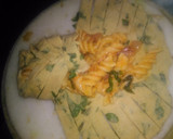 A picture of step 4 of Spinach kathi roll in fishbone wrap with red souce pasta.