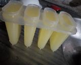 A picture of step 3 of Pineapple Popsicles.