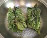 A picture of step 4 of Katla fish in gourd leaves.