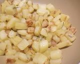 A picture of step 2 of Lemon and rosemary pan fried sea bass with sautèed potatoes.