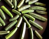 A picture of step 1 of Microwave Kukurit Bhendi - Crunchy Okra in Microwave Step By Step Recipe.
