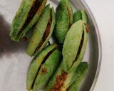A picture of step 7 of Besan stuffed karela(bitter gourds).