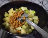 A picture of step 2 of Green papaya with black chana and potatoes.