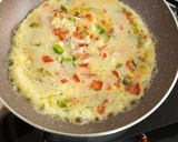 A picture of step 4 of Italian cheese and herbs omelette.