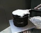 A picture of step 5 of 8 inch tall chocolate brownie cake.