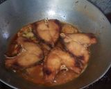 A picture of step 26 of Aloo fulcopi katla rosha ar misti doi.