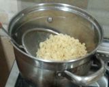 A picture of step 1 of Sausage Noodles with fried egg.