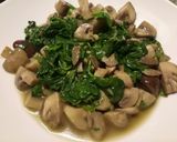 A picture of step 3 of Sauteed mushrooms and wilted spinach in garlic butter.