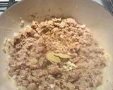 A picture of step 2 of Malloreddus alla Campidanese (pasta with saffron, tomato and pork sausage ragù).
