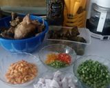 A picture of step 4 of Jollof rice with veggies with peppered chicken and goat meat.