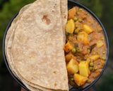 A picture of step 7 of Aloo Matar.