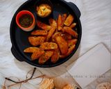 A picture of step 8 of Garlic Potato Wedges.