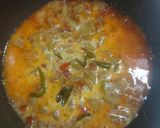 A picture of step 4 of Lauki coconut masala.