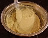 A picture of step 12 of Toasted Butter Pecan Layer Cake with Whipped White Chocolate Cream.