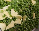 A picture of step 1 of Aloo and French beans.
