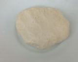 A picture of step 2 of Jingalov hats Armenian herb stuffed flatbread .