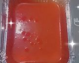 A picture of step 5 of Ty cakes, nice red coloured cake with foil tin.