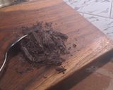 A picture of step 2 of Hershey 's cocoa almond shake.