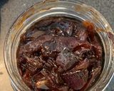 A picture of step 5 of Red onion chutney with nuts and raisins.