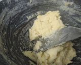 A picture of step 4 of Coconut laddu made from milk and desiccated coconut Powder.