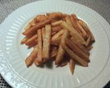 Foto del paso 12 de la receta Tiras de muslos de pollo, con patatas fritas y huevos