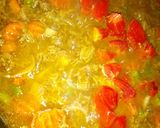 A picture of step 7 of Turmeric rice with minced meat and vegies.