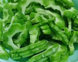 A picture of step 2 of Bitter gourd with egg.